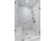 Modern bathroom with a spacious glass-enclosed shower and white tiled walls at 1059 Abington Ct, Brookhaven, GA 30319