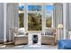 A cozy sitting area with picturesque views is located in the main bedroom at 1059 Abington Ct, Brookhaven, GA 30319
