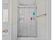 Bathroom features a glass-enclosed shower with tiled walls and a chrome towel bar at 1325 Richland Creek Ct, Sugar Hill, GA 30518
