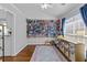 Bright bonus room featuring wall-to-wall bookshelves and natural light at 1325 Richland Creek Ct, Sugar Hill, GA 30518