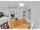 Bright dining area with adjacent rooms and vaulted ceilings at 1325 Richland Creek Ct, Sugar Hill, GA 30518