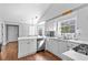 Bright kitchen with stainless appliances, breakfast bar and a view to the outside at 1325 Richland Creek Ct, Sugar Hill, GA 30518