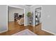 Bright living area with hardwood floors, showcasing an open layout to the kitchen at 1325 Richland Creek Ct, Sugar Hill, GA 30518