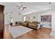 Inviting living room featuring a fireplace, hardwood flooring, and plenty of room for entertaining at 1325 Richland Creek Ct, Sugar Hill, GA 30518