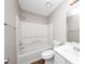 All-white bathroom with shower-tub combo and a single-sink vanity at 1444 Bridgewater Br, Stone Mountain, GA 30088