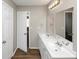 Bright bathroom featuring double sinks, plenty of counter space, and modern mirrors at 1444 Bridgewater Br, Stone Mountain, GA 30088