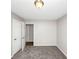 Bedroom with a gray carpet and white walls, featuring two doors at 1444 Bridgewater Br, Stone Mountain, GA 30088