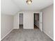Carpeted bedroom with two closet doors and natural light at 1444 Bridgewater Br, Stone Mountain, GA 30088