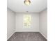 Empty bedroom featuring carpet, neutral paint, and natural light at 1444 Bridgewater Br, Stone Mountain, GA 30088