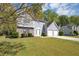 Charming two-story home with a two-car garage, stone accents, and manicured lawn at 1444 Bridgewater Br, Stone Mountain, GA 30088