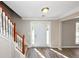 Bright foyer featuring hardwood floors, staircase, and natural light at 1444 Bridgewater Br, Stone Mountain, GA 30088