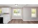 Compact eat-in kitchen with light walls and floors, plus lots of windows at 1444 Bridgewater Br, Stone Mountain, GA 30088