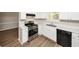 Efficient kitchen with white cabinets, stainless steel appliances, and a window at 1444 Bridgewater Br, Stone Mountain, GA 30088