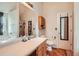 Bright bathroom with a large mirror, double sinks, a garden tub, and a separate shower at 4719 Score Ct, Snellville, GA 30039