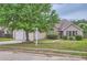 Beautiful home with manicured lawn, mature tree, and neutral exterior at 4719 Score Ct, Snellville, GA 30039