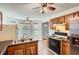Bright kitchen featuring a gas range, tiled flooring, and a stainless-steel refrigerator near the entrance at 4719 Score Ct, Snellville, GA 30039