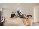 Spacious living area featuring a fireplace, vaulted ceiling, and comfortable seating at 4719 Score Ct, Snellville, GA 30039