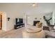 Bright living room with vaulted ceilings, cozy fireplace, and modern entertainment setup at 4719 Score Ct, Snellville, GA 30039