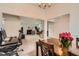 Open-concept living area featuring a fireplace, office nook, dining space, and view into a carpeted living room at 4719 Score Ct, Snellville, GA 30039