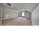 Finished attic space with patterned ceiling, carpeting, and window for natural light at 132 Garden Manor Ct, Loganville, GA 30052