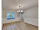 Bright dining room featuring modern lighting, and ample natural light at 132 Garden Manor Ct, Loganville, GA 30052