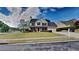 Charming two-story home with a well-manicured lawn and traditional architecture at 132 Garden Manor Ct, Loganville, GA 30052