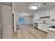 Modern kitchen featuring new appliances, and adjacent dining area at 132 Garden Manor Ct, Loganville, GA 30052