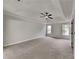 Large primary bedroom showcasing a tray ceiling, neutral walls and lots of space at 132 Garden Manor Ct, Loganville, GA 30052