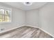 Bedroom featuring light gray walls and wood-look flooring at 164 Polar Rock Sw Dr, Atlanta, GA 30315