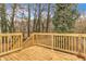 New wooden deck with railings and stairs offers a great outdoor space for relaxing or entertaining at 164 Polar Rock Sw Dr, Atlanta, GA 30315