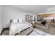 Well-lit bedroom featuring large windows, comfortable bed, rug, and storage shelves at 1805 Harvard Ave # 207, College Park, GA 30337