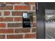 Resident entrance sign on red brick wall, Ion Arts apartment complex at 1805 Harvard Ave # 207, College Park, GA 30337