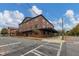 Brick apartment building with covered walkway, crosswalk in front at 1805 Harvard Ave # 207, College Park, GA 30337
