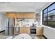 Bright kitchen featuring stainless steel appliances, modern cabinets, and a subway tile backsplash at 1805 Harvard Ave # 207, College Park, GA 30337