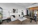 Comfortable living room with sofa, coffee table, and adjacent kitchen at 1805 Harvard Ave # 207, College Park, GA 30337