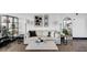 Stylish living room featuring comfortable sofa, coffee table, rug, and decorative art at 1805 Harvard Ave # 207, College Park, GA 30337