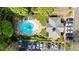 Aerial view of community pool, clubhouse and parking area, surrounded by lush trees at 2103 Stratford Commons, Decatur, GA 30033