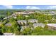 Aerial view of condo community surrounded by mature trees, featuring a swimming pool and beautiful landscaping at 2103 Stratford Commons, Decatur, GA 30033