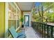 Relaxing balcony with two chairs, a small table, and views of the natural surrounding greenery at 2103 Stratford Commons, Decatur, GA 30033