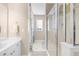Bright and clean bathroom featuring a glass enclosed shower and a large white vanity with dual sinks at 2103 Stratford Commons, Decatur, GA 30033