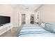Bright bedroom with neutral walls, plush carpet, a large TV, and a view of the closet and bathroom at 2103 Stratford Commons, Decatur, GA 30033