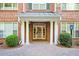 Welcoming entrance with brick facade, a covered porch, and stately white columns at 2103 Stratford Commons, Decatur, GA 30033