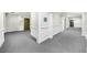 Hallway with neutral carpet, classic molding, and convenient elevator access at 2103 Stratford Commons, Decatur, GA 30033