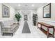 Hallway showcasing clean tile flooring, elegant furnishings, and decorative plants at 2103 Stratford Commons, Decatur, GA 30033