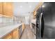 Kitchen featuring stainless steel appliances, hardwood floors, and neutral countertops at 2103 Stratford Commons, Decatur, GA 30033