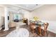 Living and dining areas with hardwood floors, columns, and comfortable furniture at 2103 Stratford Commons, Decatur, GA 30033