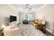 Spacious living room with ceiling fan, natural light, comfortable seating, and plush rug at 2103 Stratford Commons, Decatur, GA 30033
