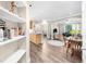 Open-concept space with hardwood floors, archways, and decorative shelving at 2103 Stratford Commons, Decatur, GA 30033