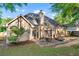 The back exterior is a beautiful shot of the patio and the backyard, perfect for relaxing and outdoor entertaining at 705 Branch Tree Way, Lawrenceville, GA 30043