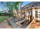 Backyard patio with dining and lounging furniture and view of a well-maintained lawn at 705 Branch Tree Way, Lawrenceville, GA 30043